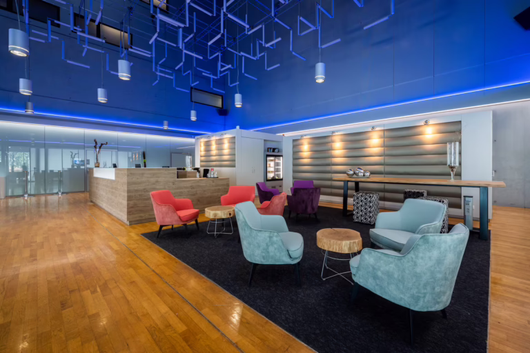 Wyndham Frankfurt Niederrad features a contemporary lobby anchored by a striking central atrium.